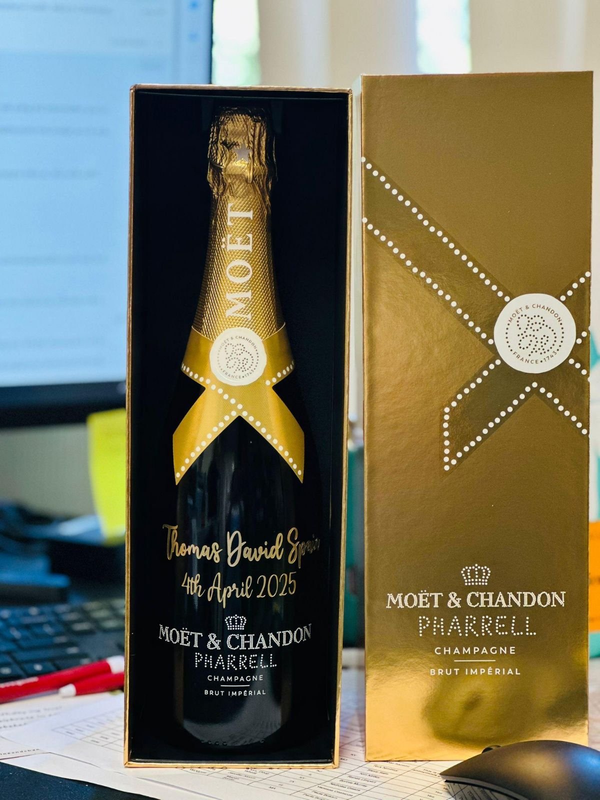 Champagne bottle engraved with a custom congratulatory message