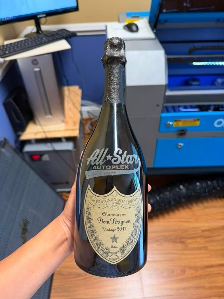 Wine bottle engraved with a name and date